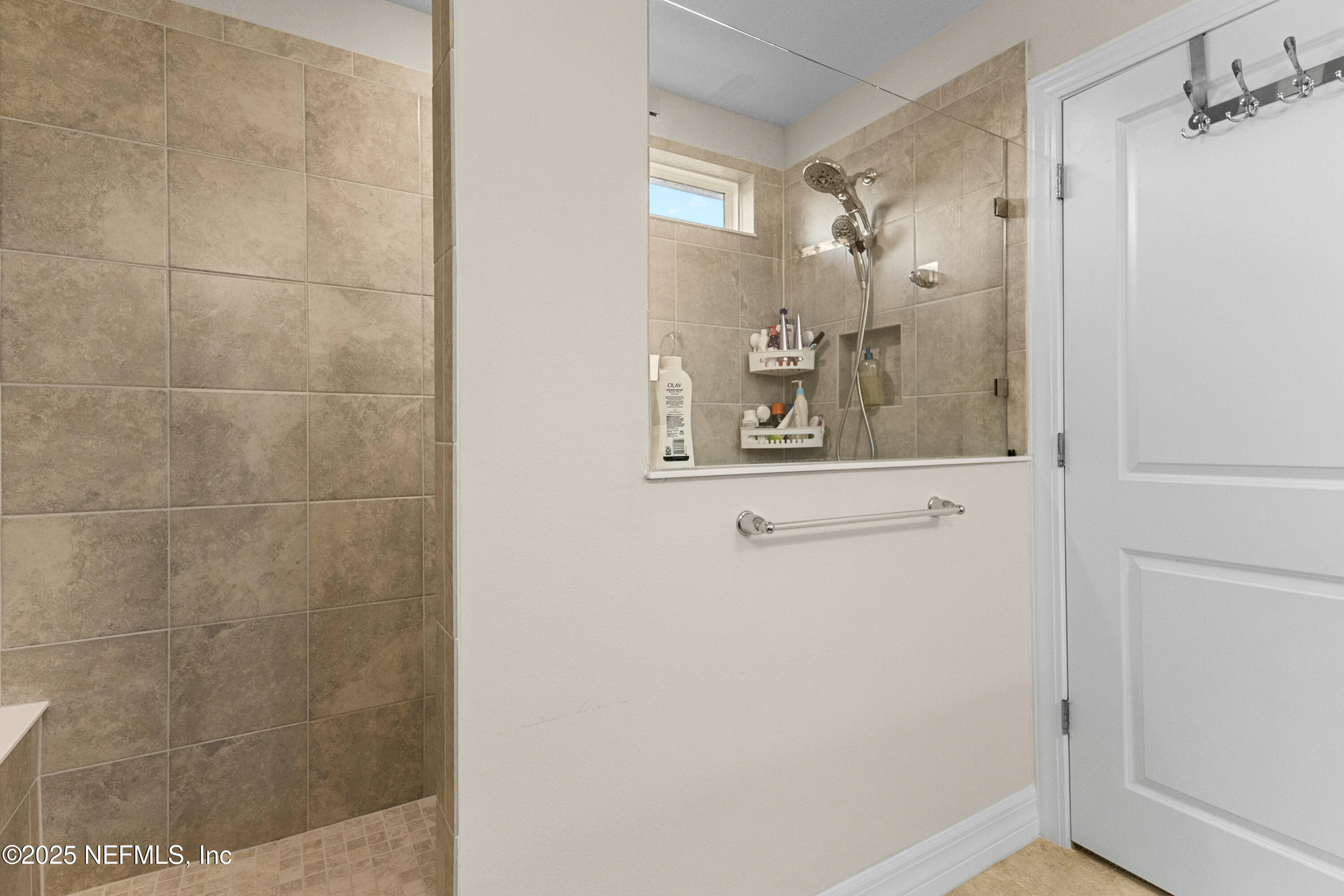 27 Flintlock Ln Street St. Augustine, FL 32095 - Photo 57 of 65 a bathroom with a glass shower door