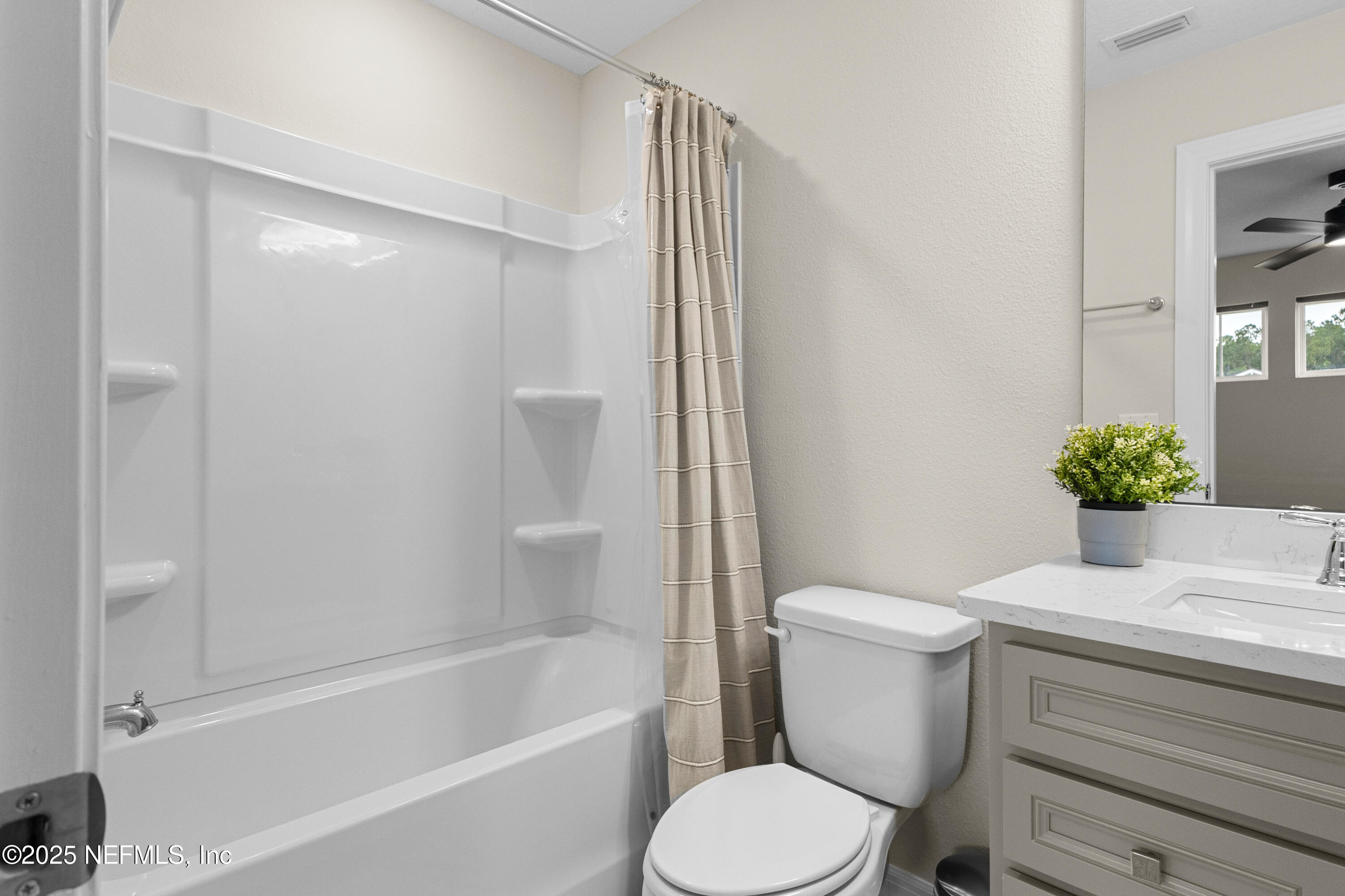 27 Flintlock Ln Street St. Augustine, FL 32095 - Photo 60 of 65 a white toilet sitting next to a bath tub