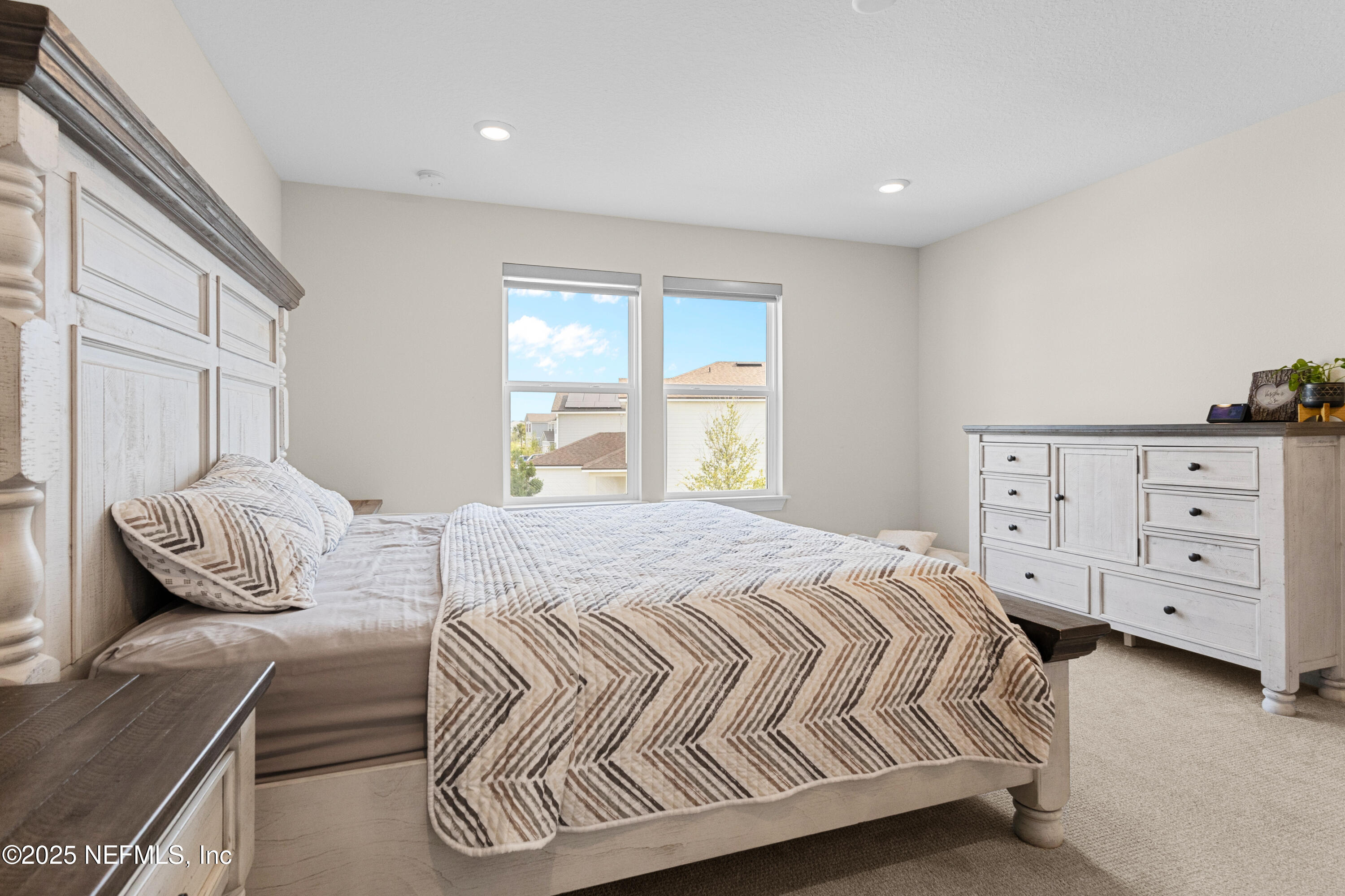 27 Flintlock Ln Street St. Augustine, FL 32095 - Photo 6 of 65 a bedroom with a bed and a window