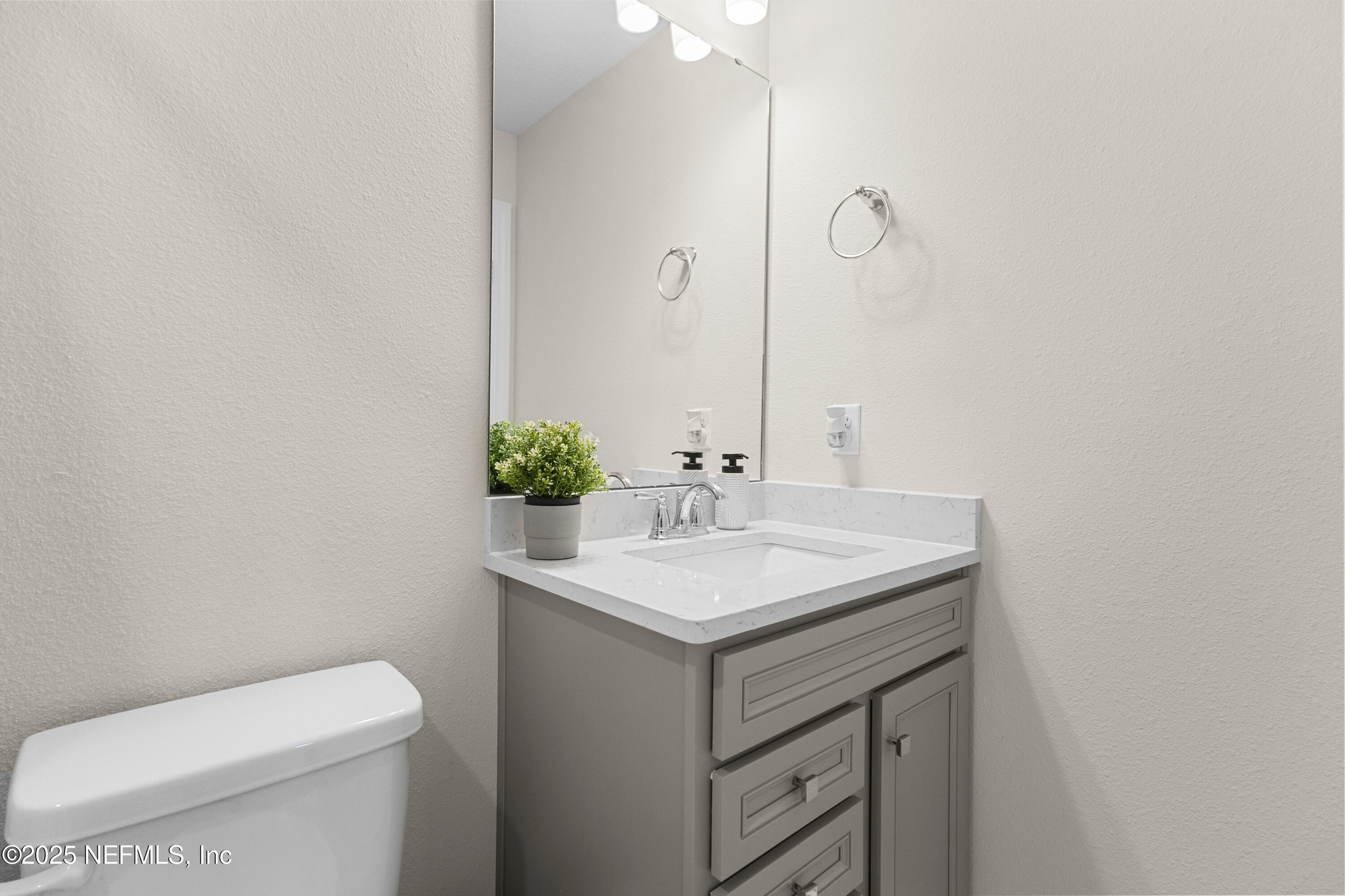 27 Flintlock Ln Street St. Augustine, FL 32095 - Photo 61 of 65 a bathroom with a sink toilet and mirror