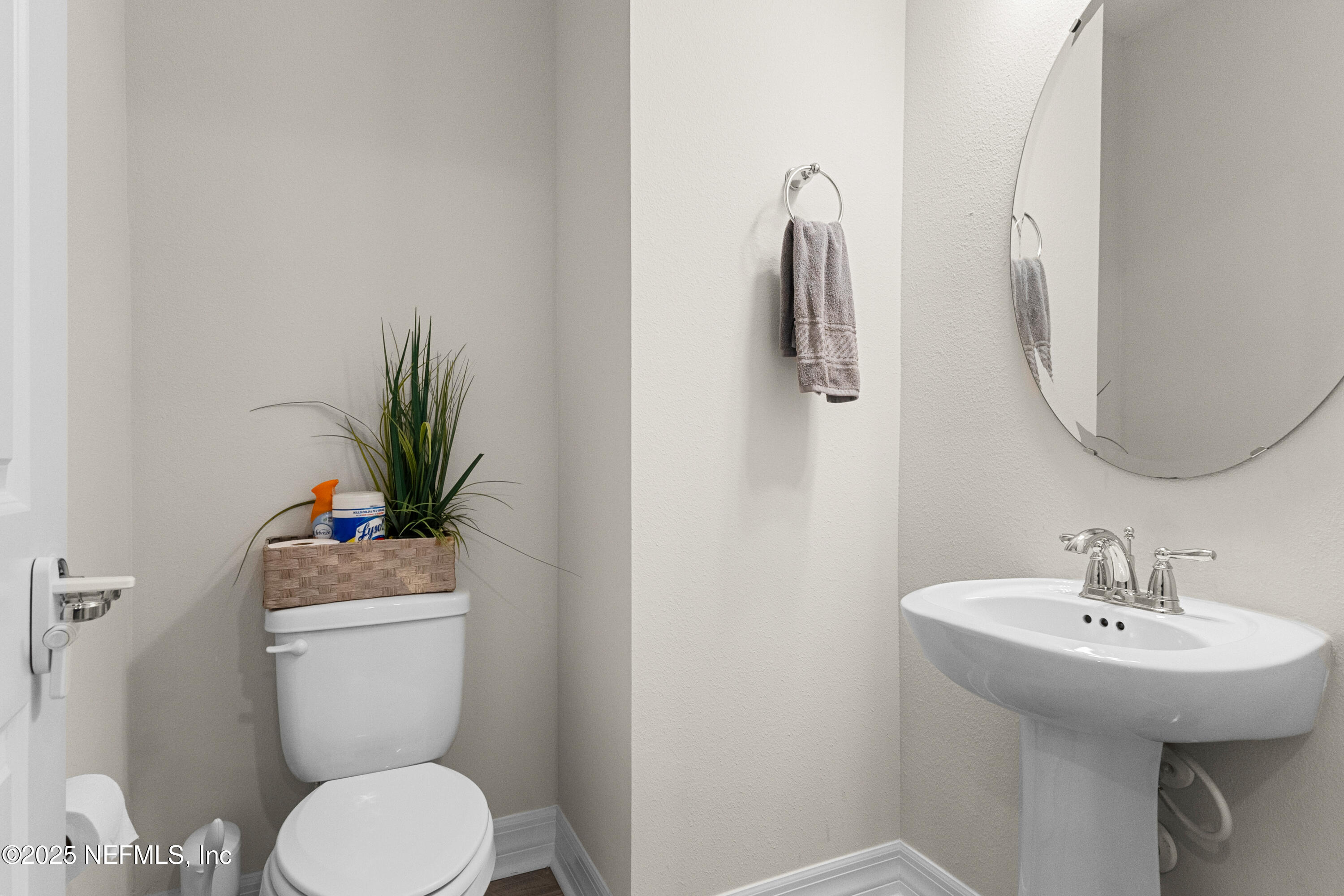 27 Flintlock Ln Street St. Augustine, FL 32095 - Photo 64 of 65 a bathroom with a toilet sink and mirror