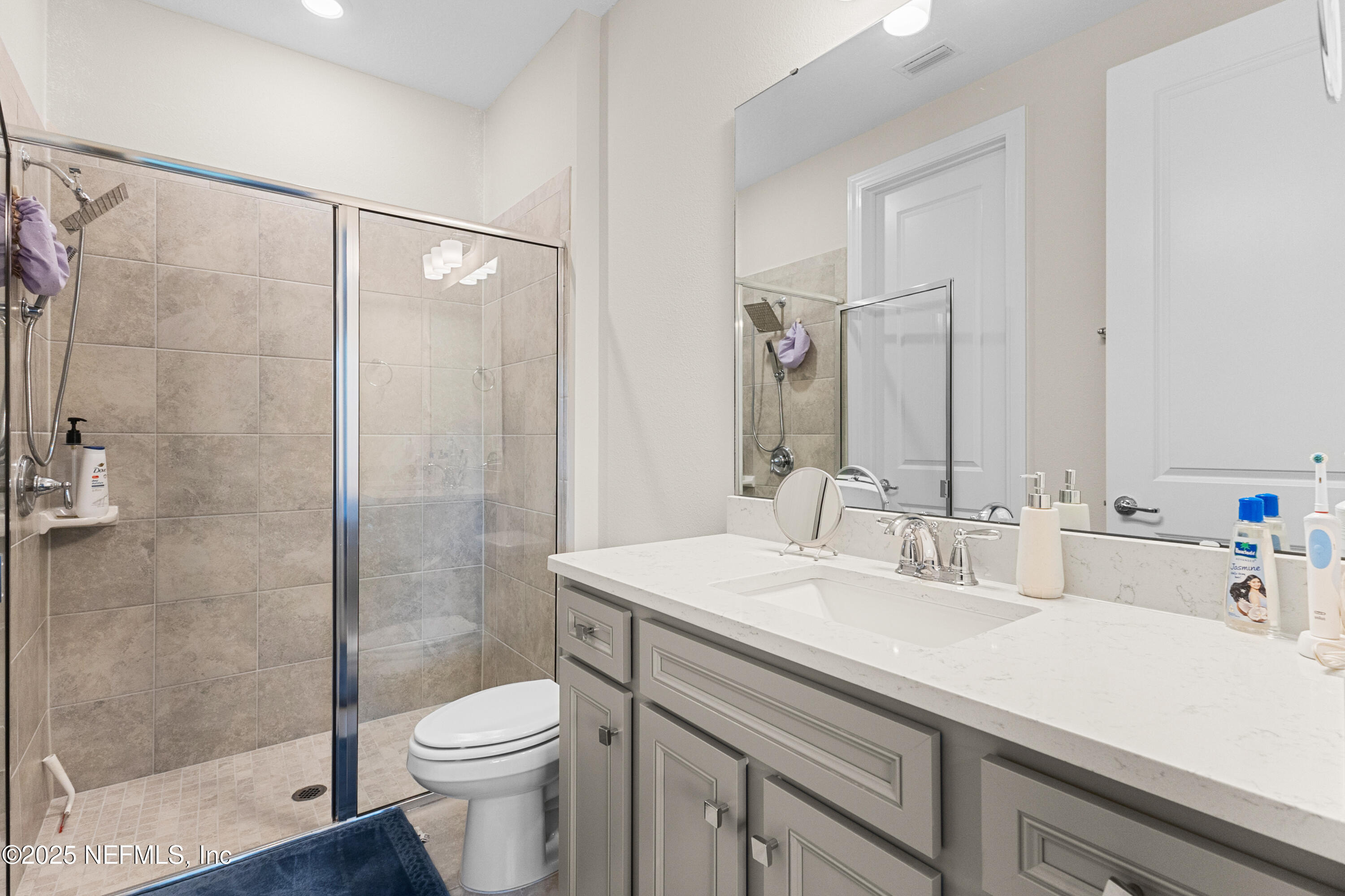 27 Flintlock Ln Street St. Augustine, FL 32095 - Photo 65 of 65 a bathroom with a sink toilet and shower