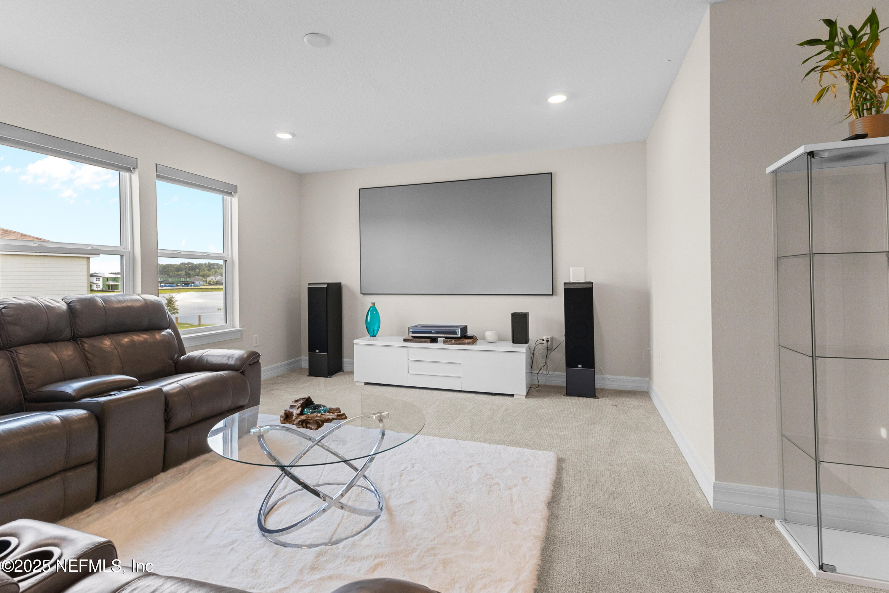 27 Flintlock Ln Street St. Augustine, FL 32095 - Photo 7 of 65 a living room with furniture and a refrigerator