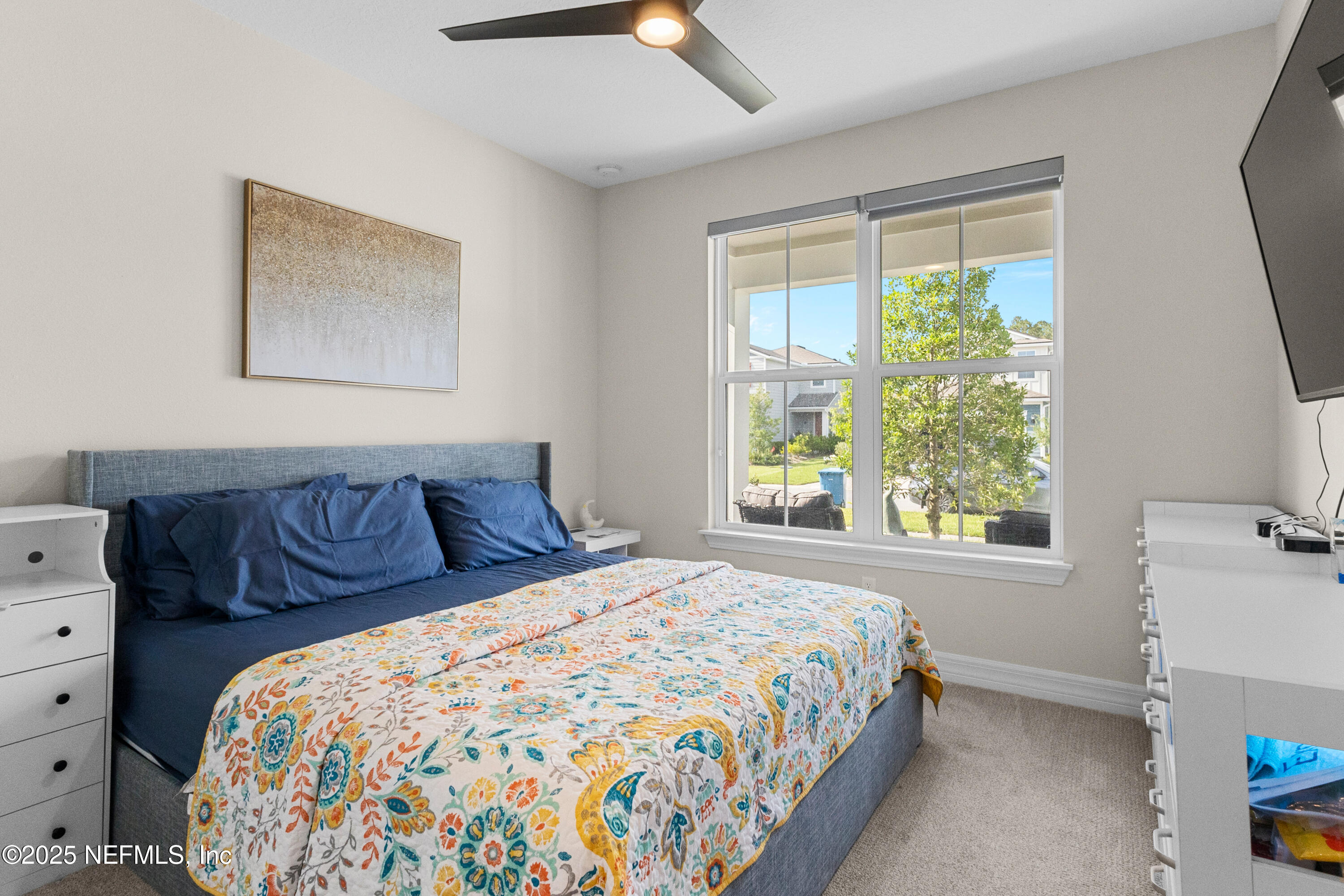 27 Flintlock Ln Street St. Augustine, FL 32095 - Photo 10 of 65 a bedroom with a large bed and a window