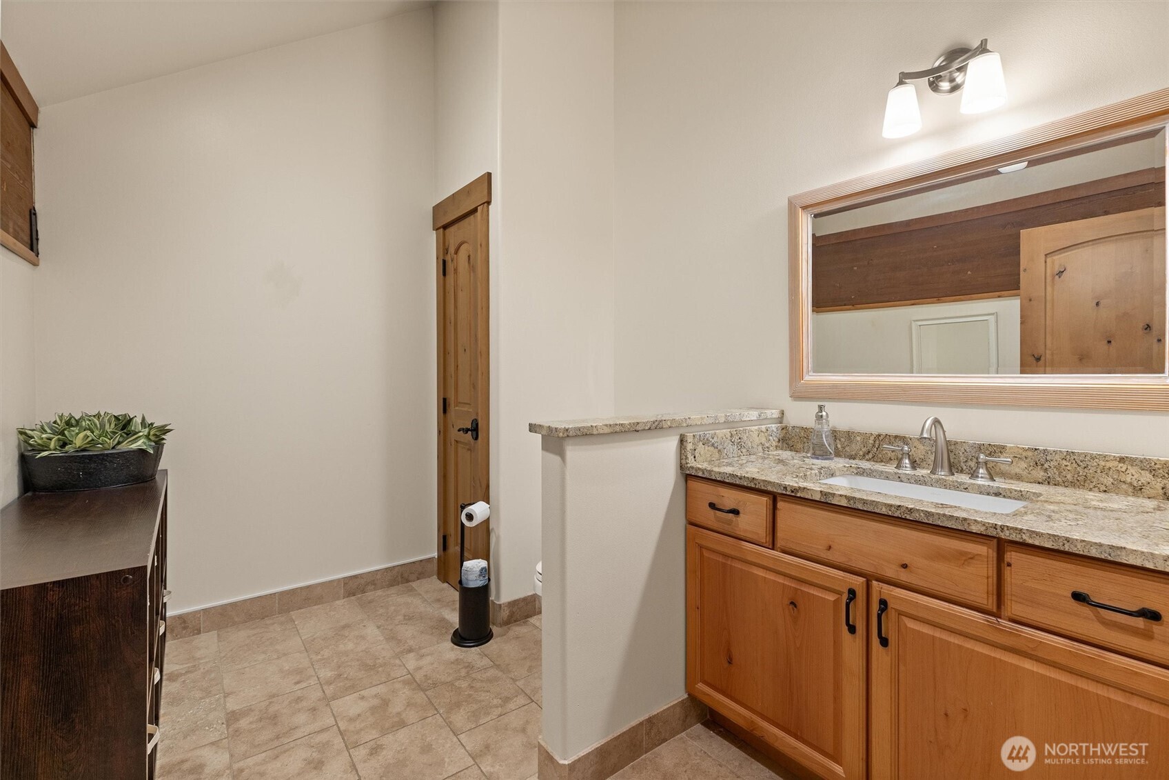 251 Evergreen Valley Loop Road Ronald, WA 98940 - Photo 28 of 38 a bathroom with a granite countertop sink and a mirror