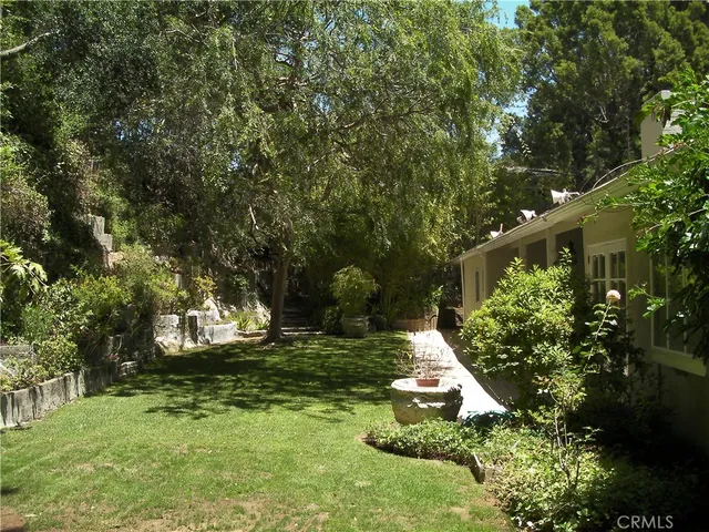 a backyard of a house with lots of green space