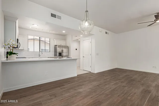 a view of a kitchen with marble kitchen and kitchen sink