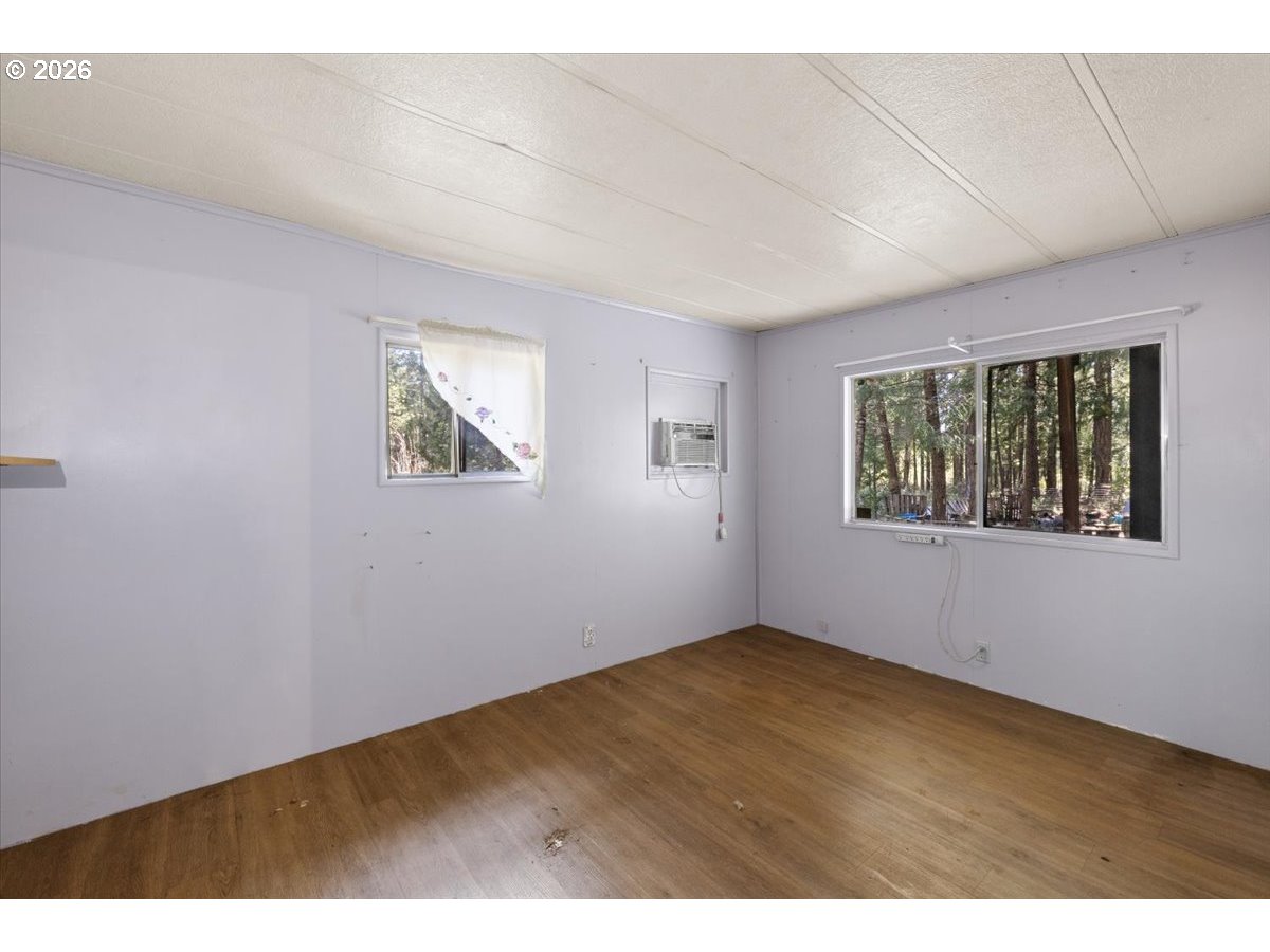 280 Cobalt Drive O'Brien, OR 97523 - Photo 14 of 27 an empty room with windows