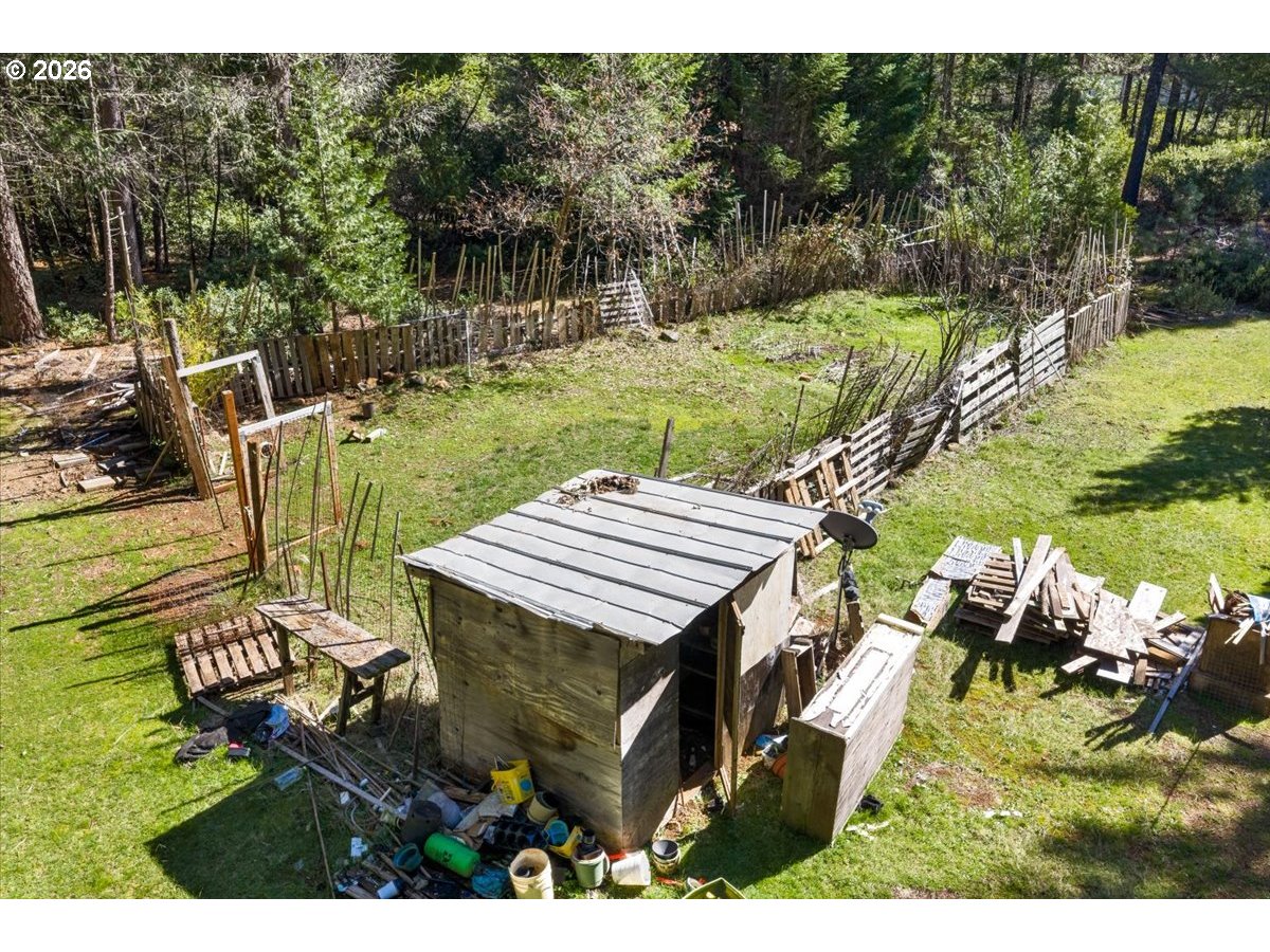 280 Cobalt Drive O'Brien, OR 97523 - Photo 20 of 27 a view of a backyard with plants and lake view