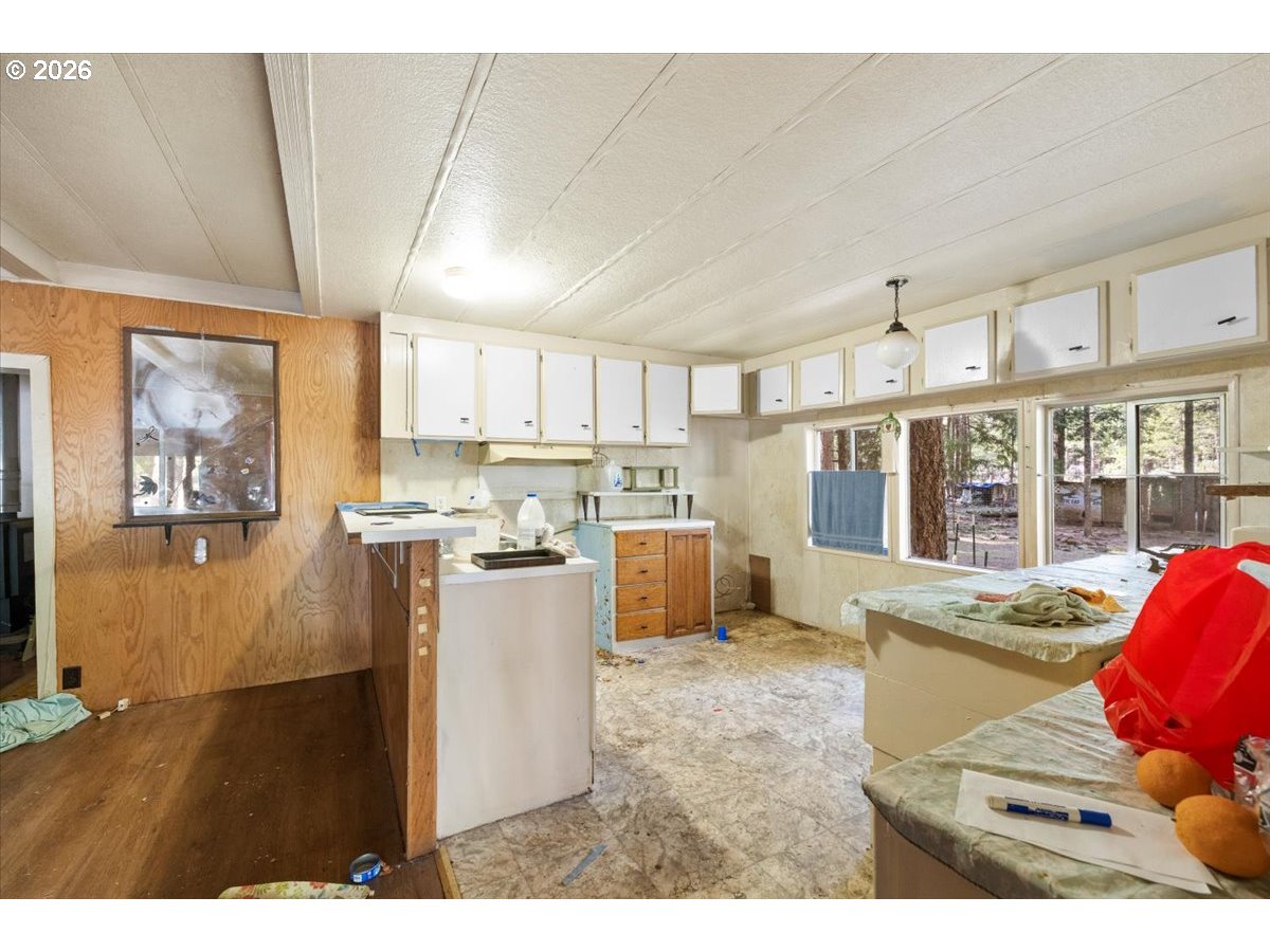 280 Cobalt Drive O'Brien, OR 97523 - Photo 4 of 27 a kitchen with a refrigerator a stove and a wooden cabinets