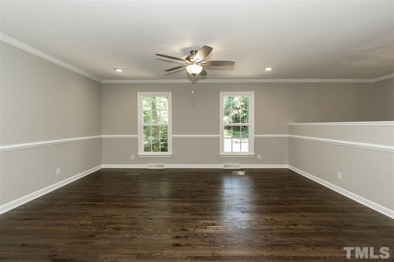 7204 Grist Mill Road Raleigh, NC 27615 - Photo 14 of 30 wooden floor in an empty room with a window