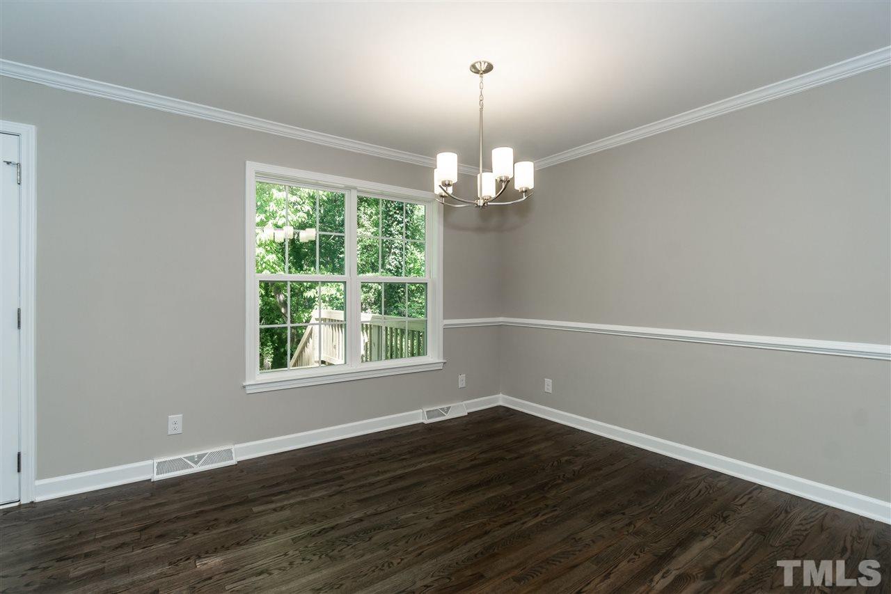 7204 Grist Mill Road Raleigh, NC 27615 - Photo 15 of 30 an empty room with wooden floor and windows