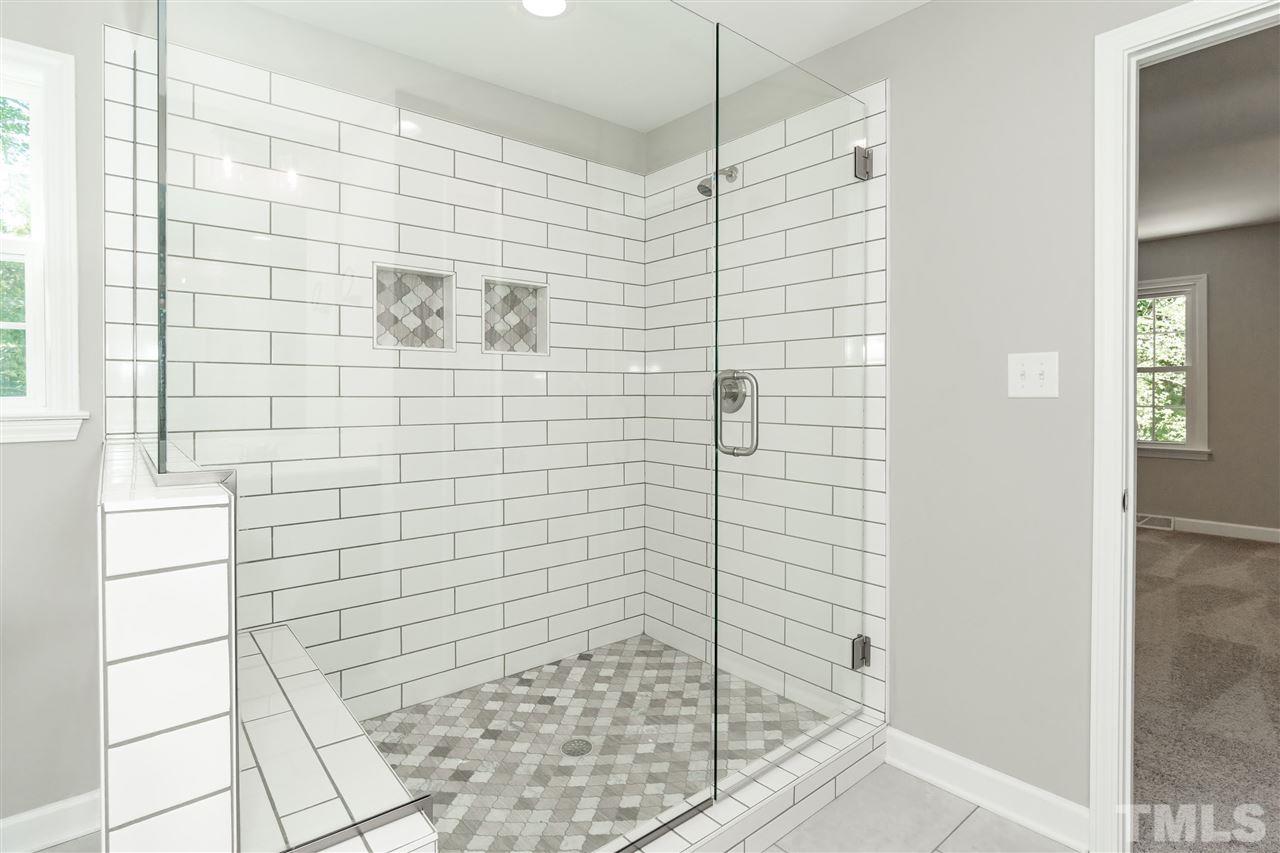 7204 Grist Mill Road Raleigh, NC 27615 - Photo 19 of 30 a bathroom with a shower