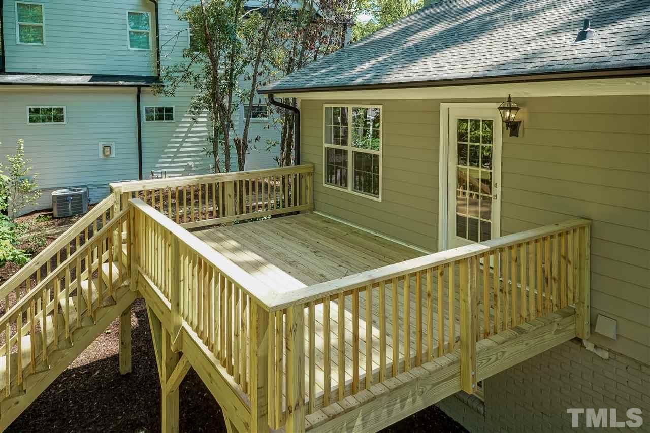 7204 Grist Mill Road Raleigh, NC 27615 - Photo 28 of 30 a view of balcony with wooden floor and fence