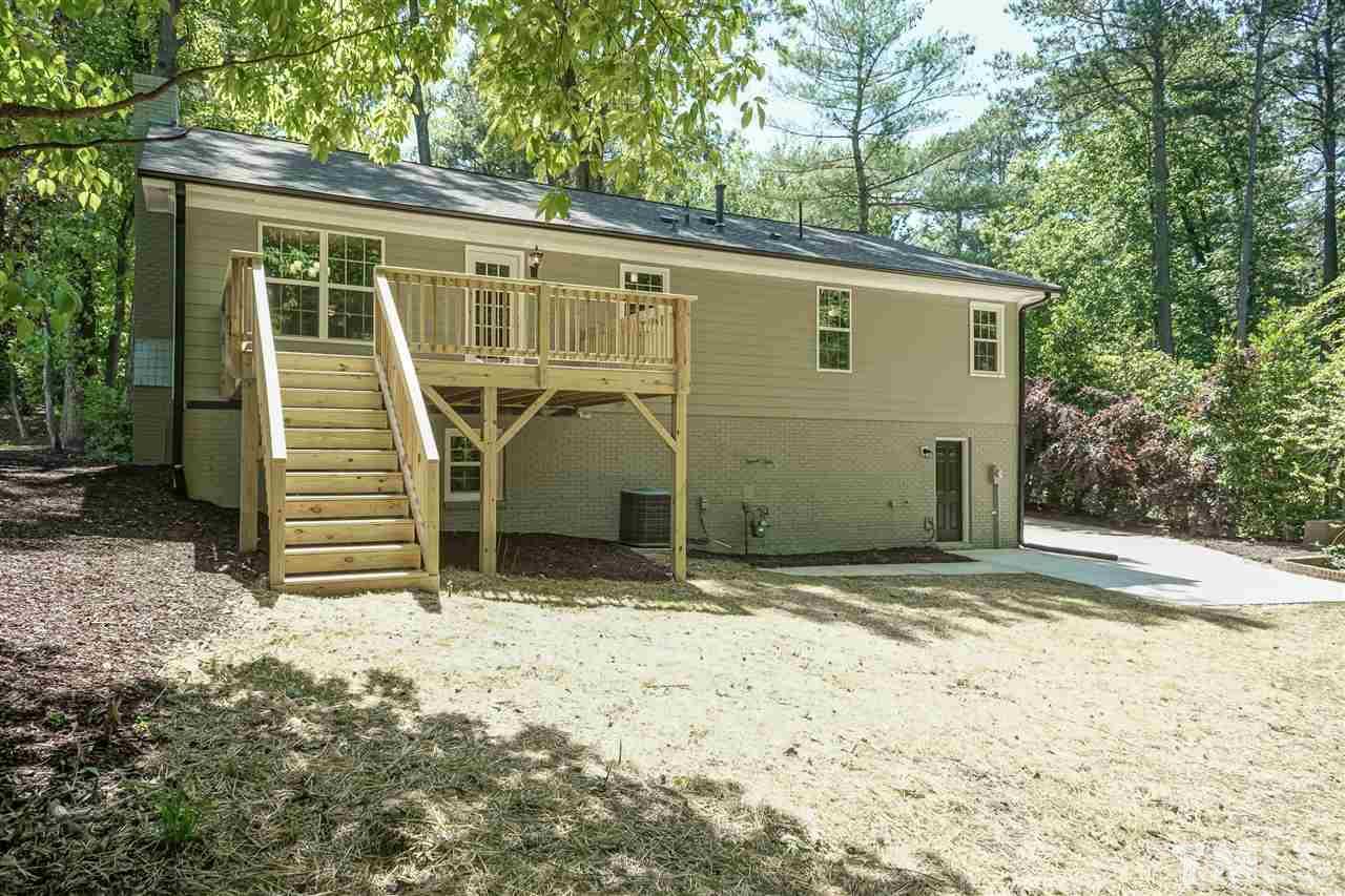 7204 Grist Mill Road Raleigh, NC 27615 - Photo 29 of 30 a view of a house with a yard