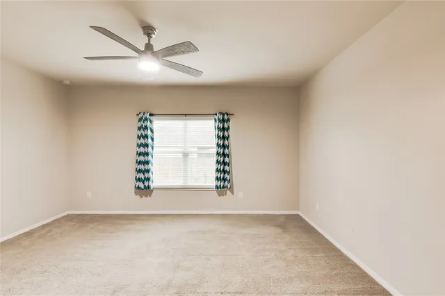 a bathroom with a shower and a sink