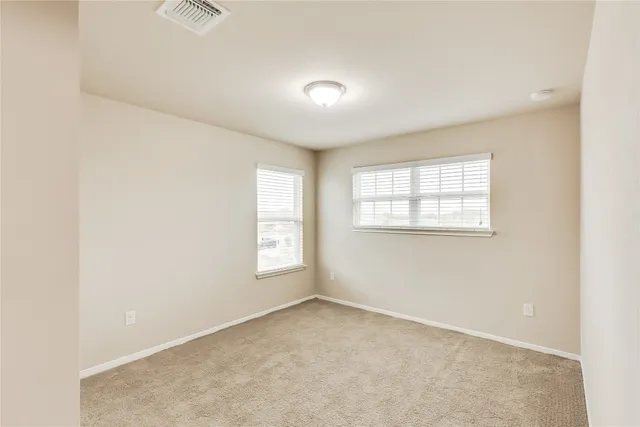 a view of a house with backyard and porch