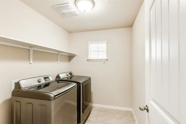 a view of a house with a backyard and a patio
