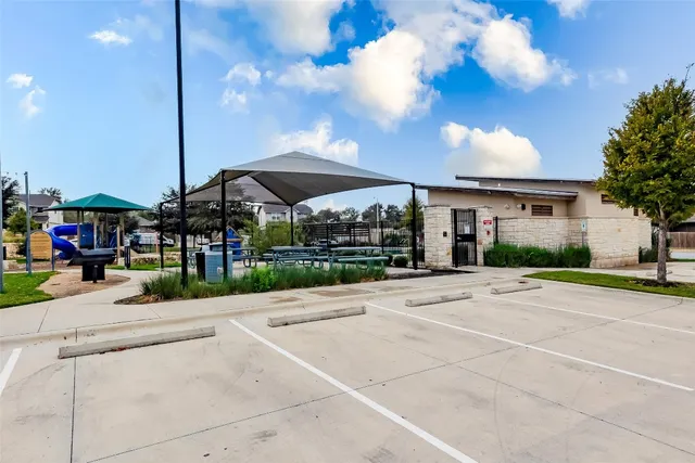 a view of a swimming pool with a patio