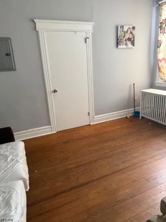 a view of a room with wooden floor and small space