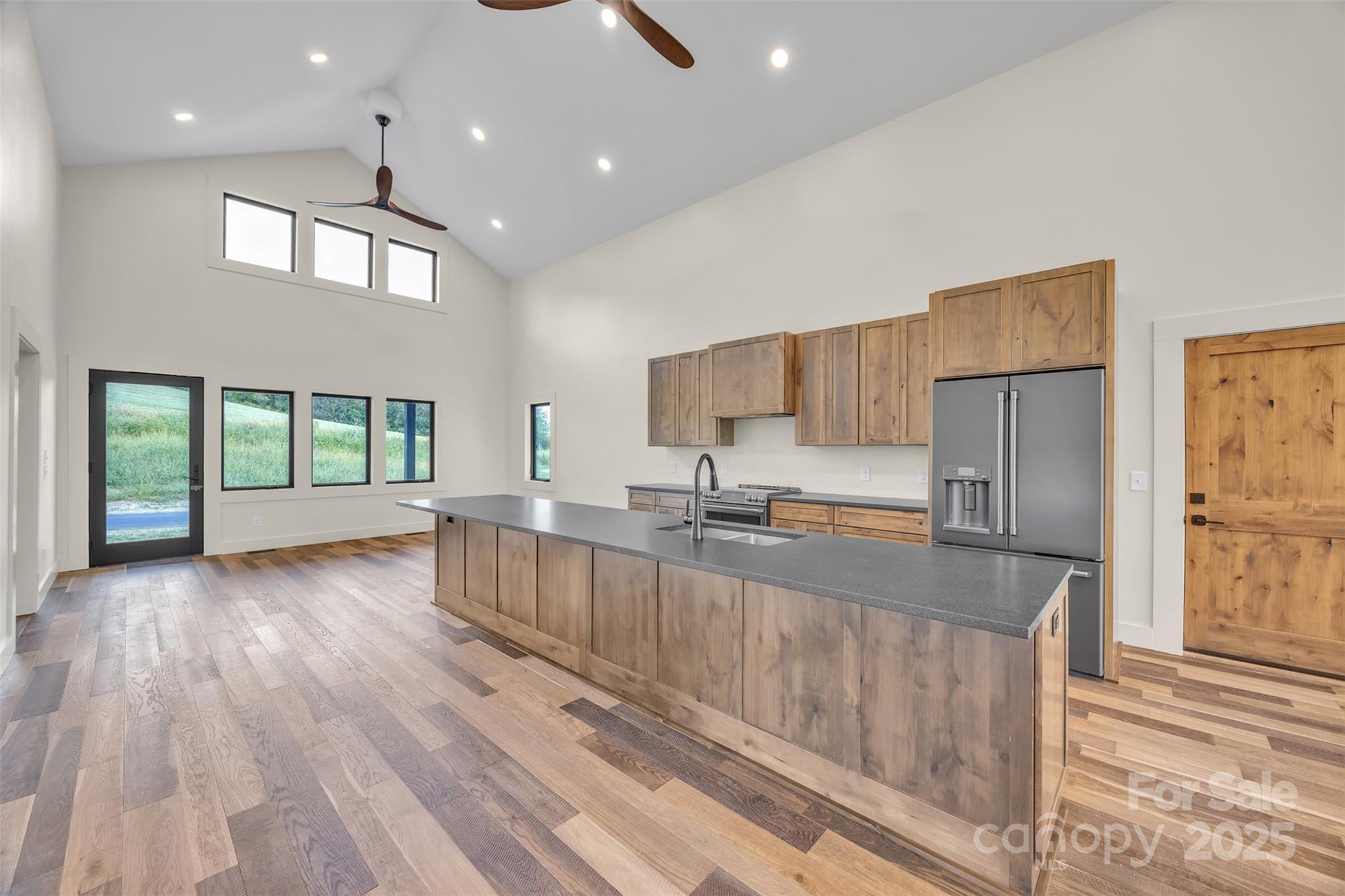 Tbd Range View Drive Jefferson, NC 28640 - Photo 12 of 46 a large kitchen with stainless steel appliances granite countertop a large stove a sink dishwasher and a large refrigerator with wooden floor