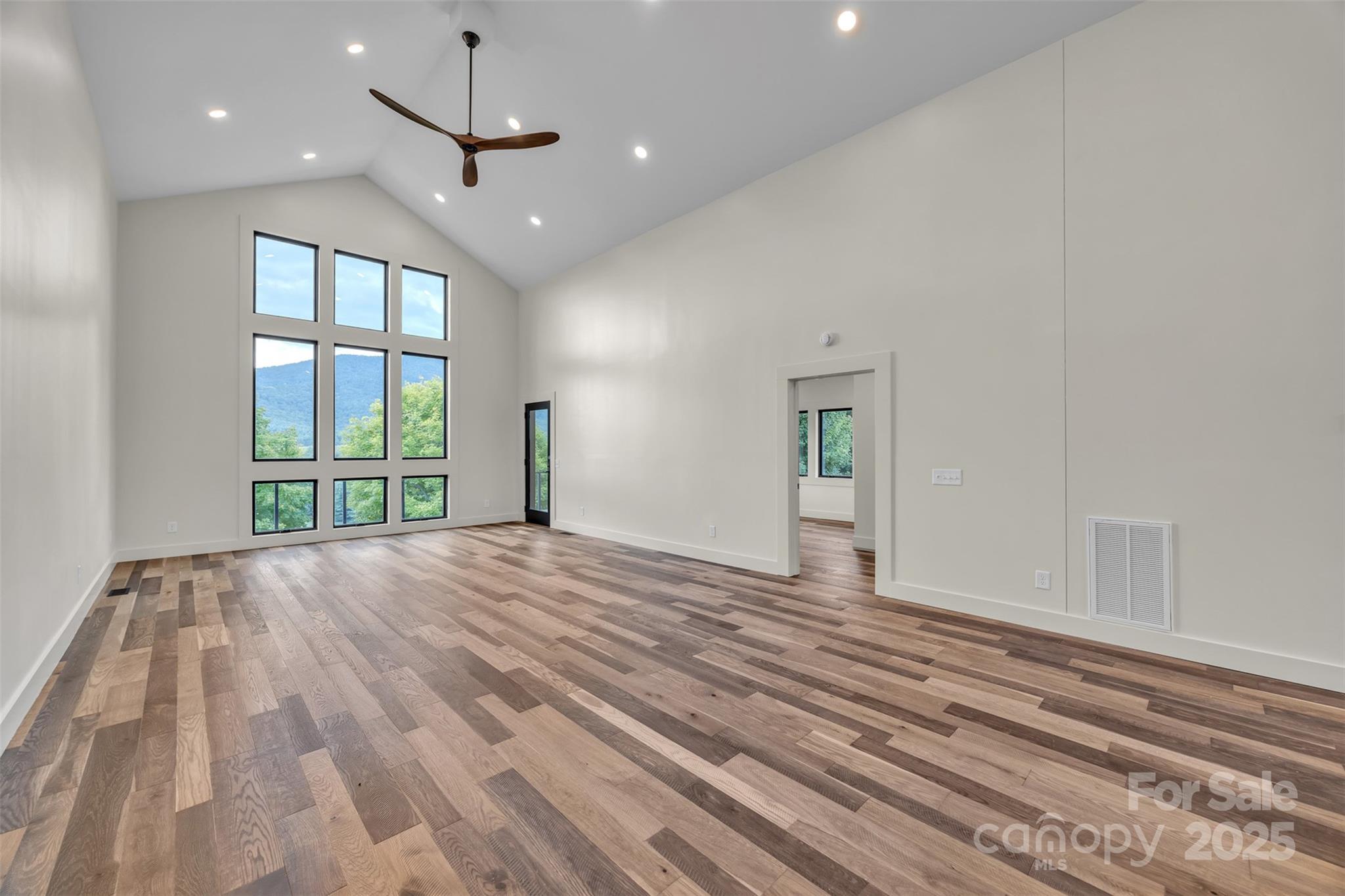 Tbd Range View Drive Jefferson, NC 28640 - Photo 15 of 46 a view of an empty room with a window and wooden floor