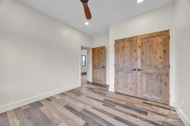 a view of a livingroom with wooden floor