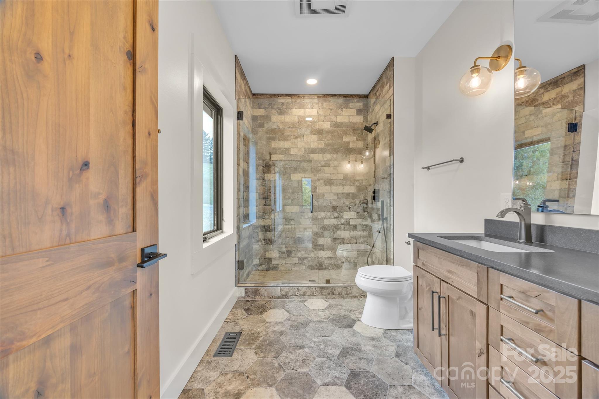 Tbd Range View Drive Jefferson, NC 28640 - Photo 29 of 46 a bathroom with a granite countertop sink toilet and shower