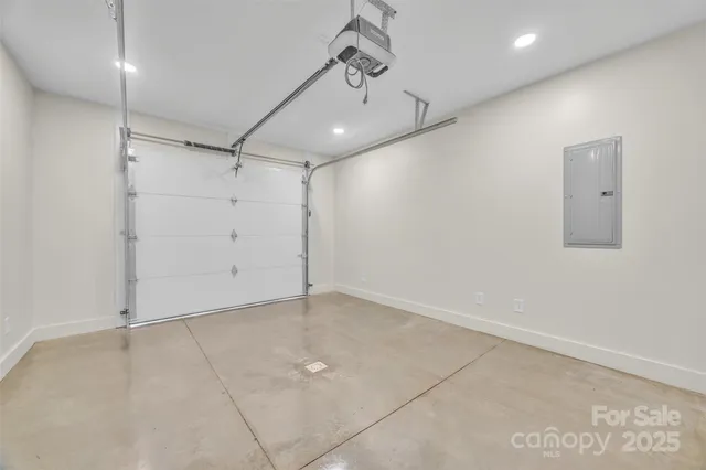 an empty room with a ceiling fan and windows