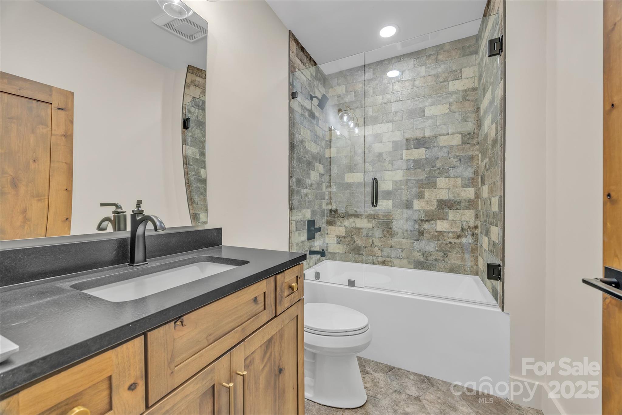 Tbd Range View Drive Jefferson, NC 28640 - Photo 38 of 46 a bathroom with a granite countertop sink a toilet and shower