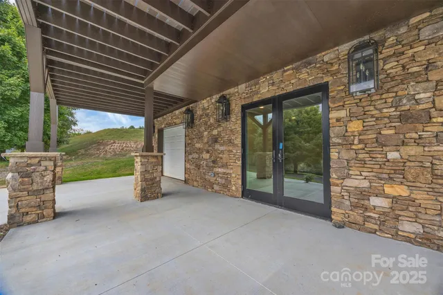 a view of an outdoor space with brick wall