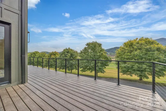 a view of outdoor space with deck and yard