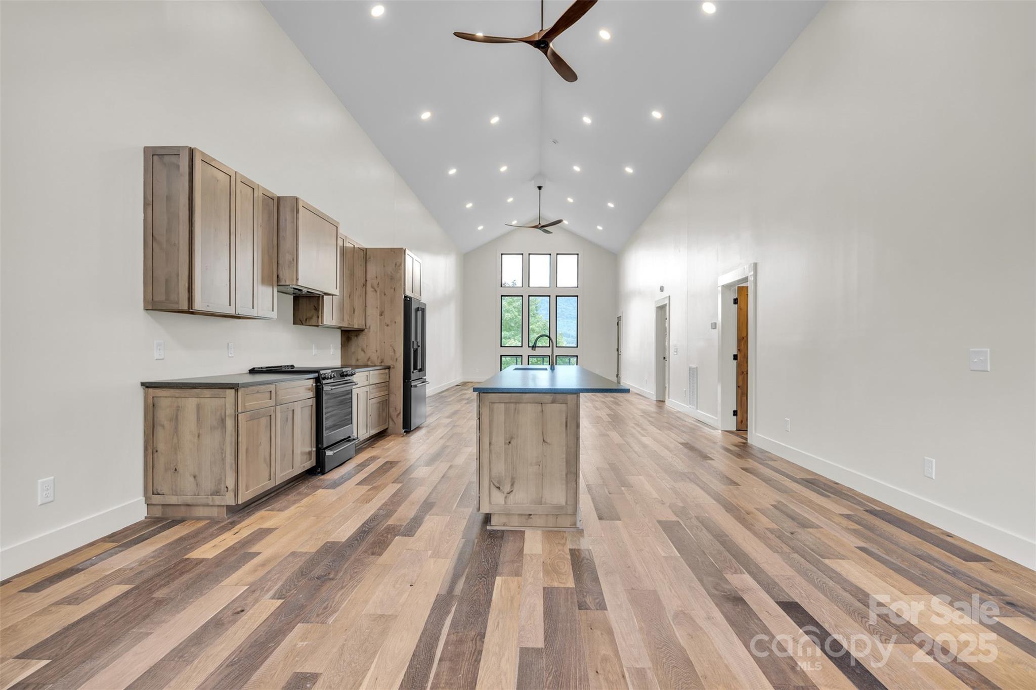 Tbd Range View Drive Jefferson, NC 28640 - Photo 9 of 46 a view of a kitchen with kitchen island wooden floor center island stainless steel appliances and cabinets