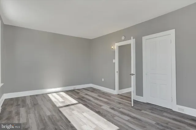 a view of room with wooden floor