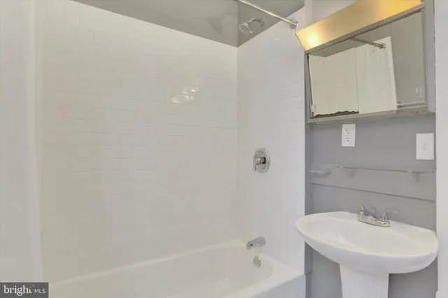 a bathroom with a sink and a bathtub