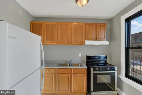 a kitchen with a stove and a microwave