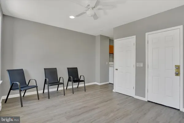 a view of a livingroom with furniture and wooden floor