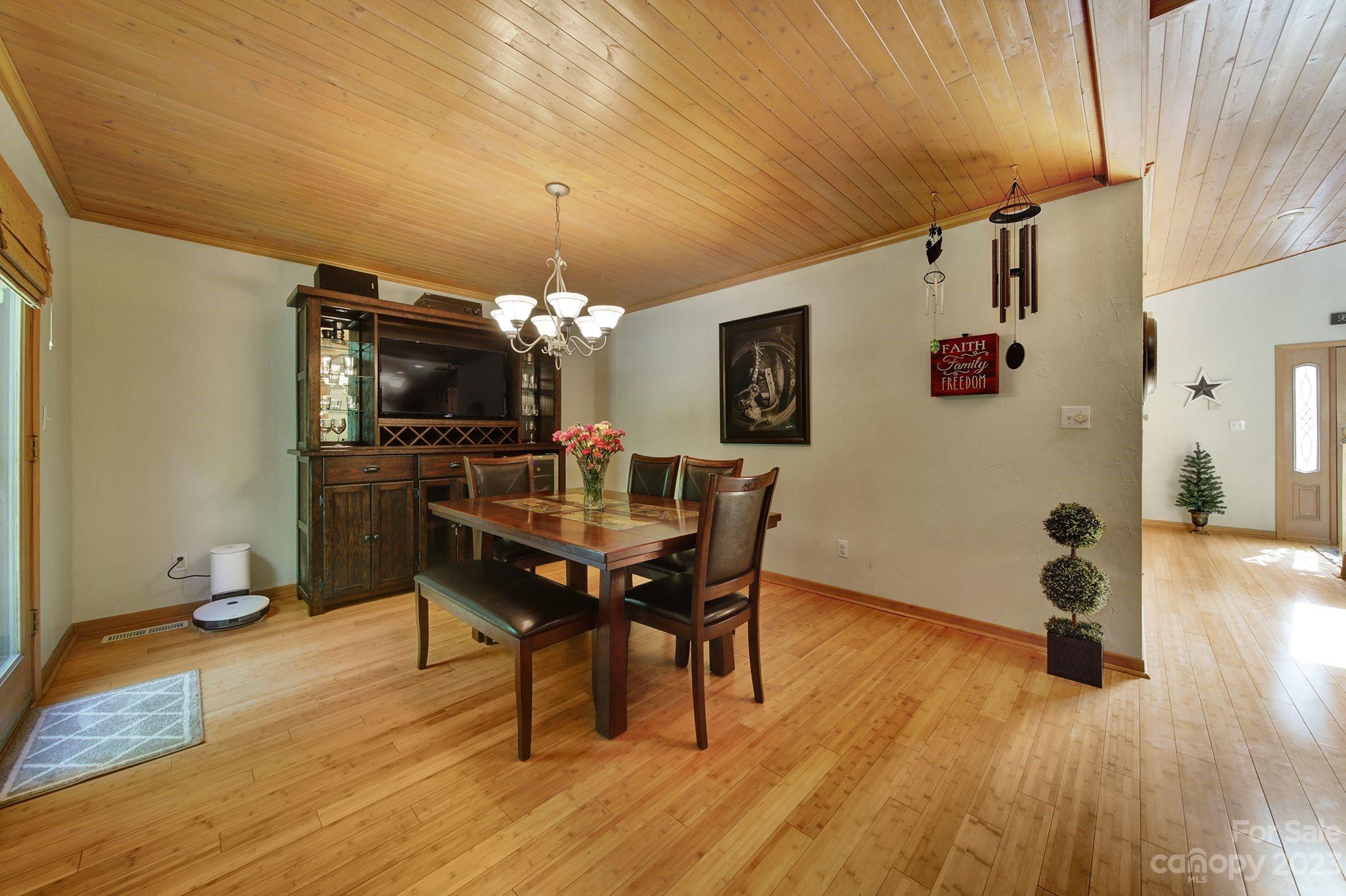 332 Boggs Road Thomasville, NC 27360 - Photo 11 of 41 a view of a dining room with furniture and wooden floor