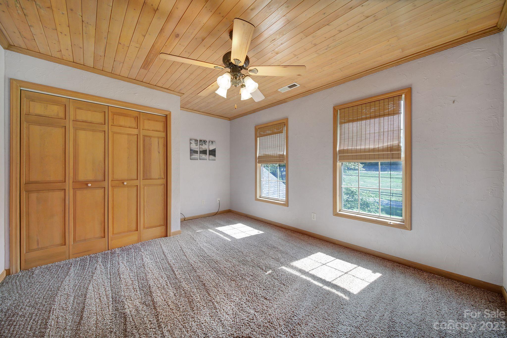 332 Boggs Road Thomasville, NC 27360 - Photo 19 of 41 a view of an empty room with a window and wooden floor