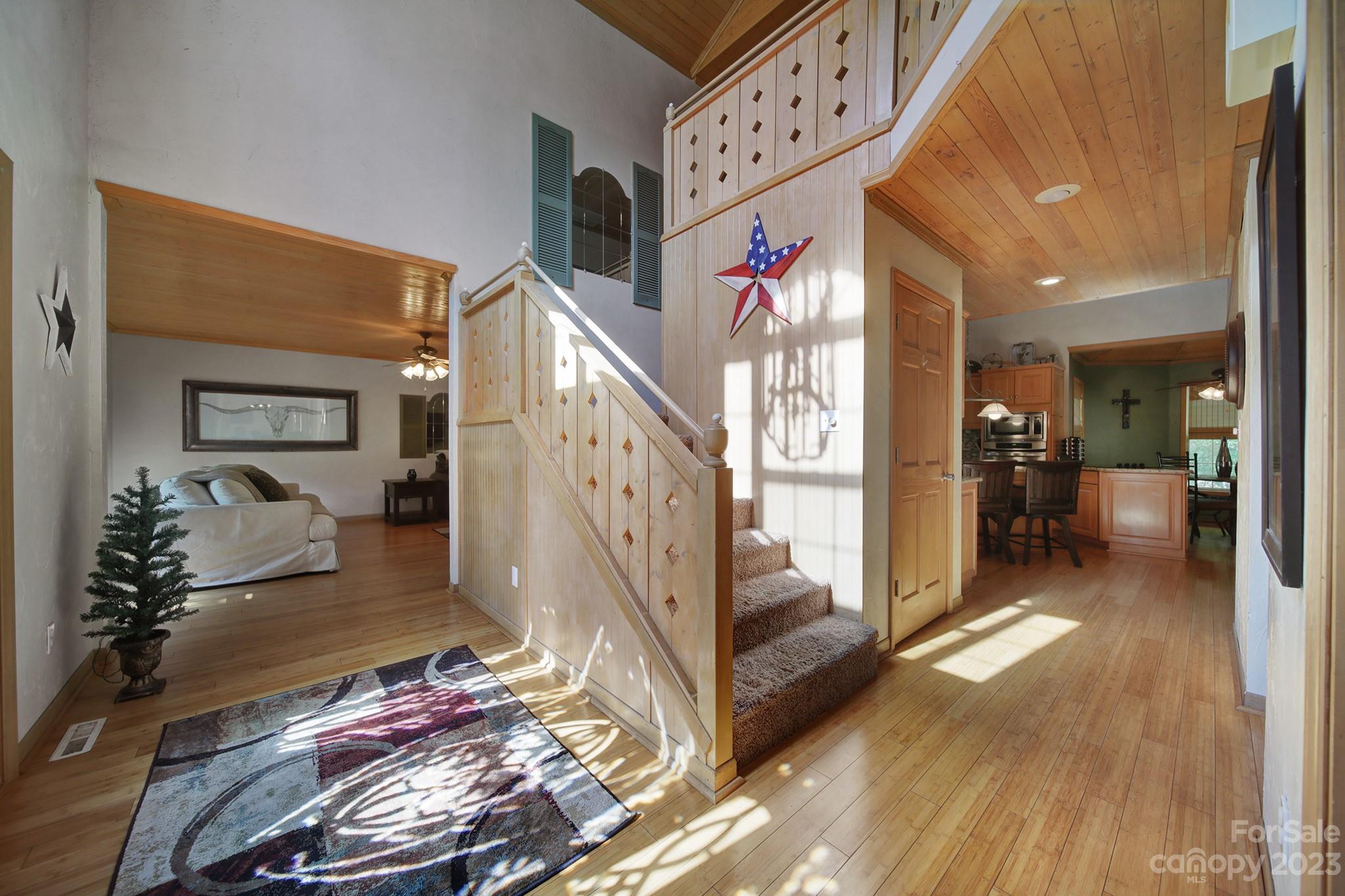 332 Boggs Road Thomasville, NC 27360 - Photo 2 of 41 a view of a hallway with dining area and chandelier