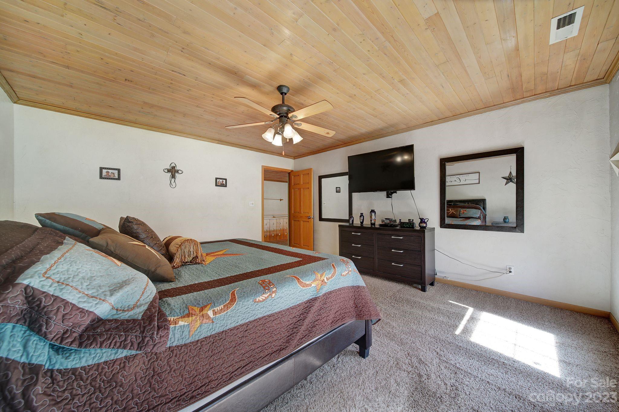 332 Boggs Road Thomasville, NC 27360 - Photo 22 of 41 a living room with furniture and a flat screen tv