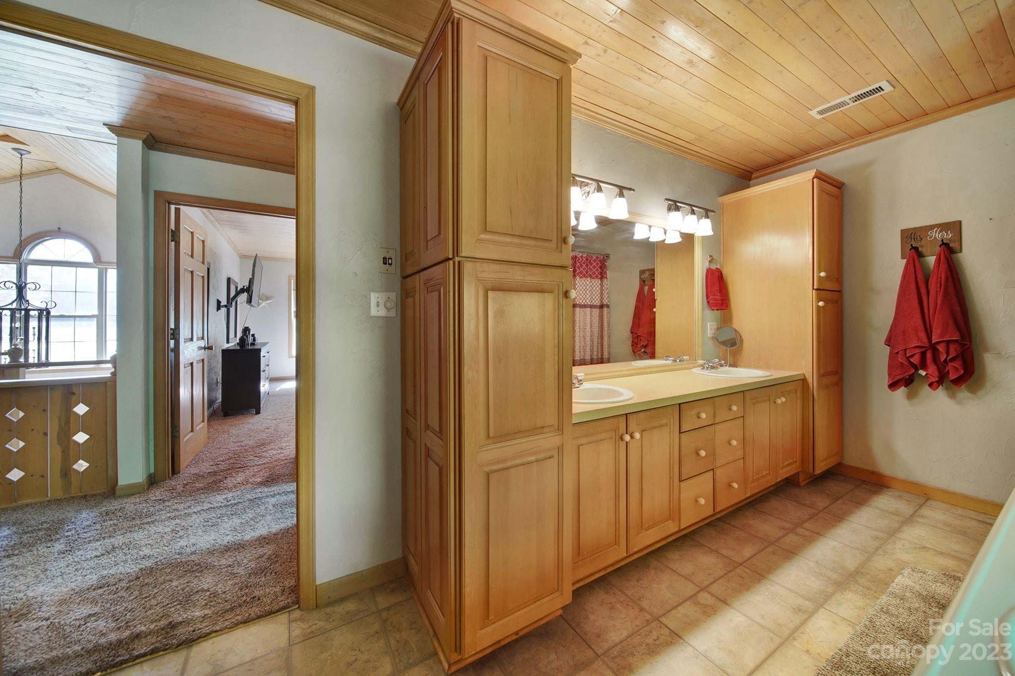 332 Boggs Road Thomasville, NC 27360 - Photo 24 of 41 a bathroom with a double vanity sink and a mirror