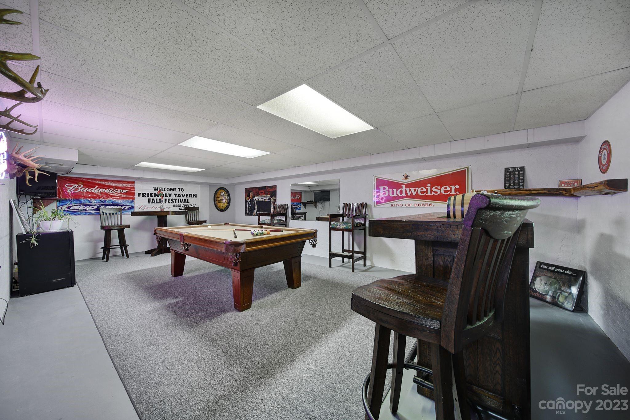 332 Boggs Road Thomasville, NC 27360 - Photo 26 of 41 a living room with lots of furniture and a flat screen tv