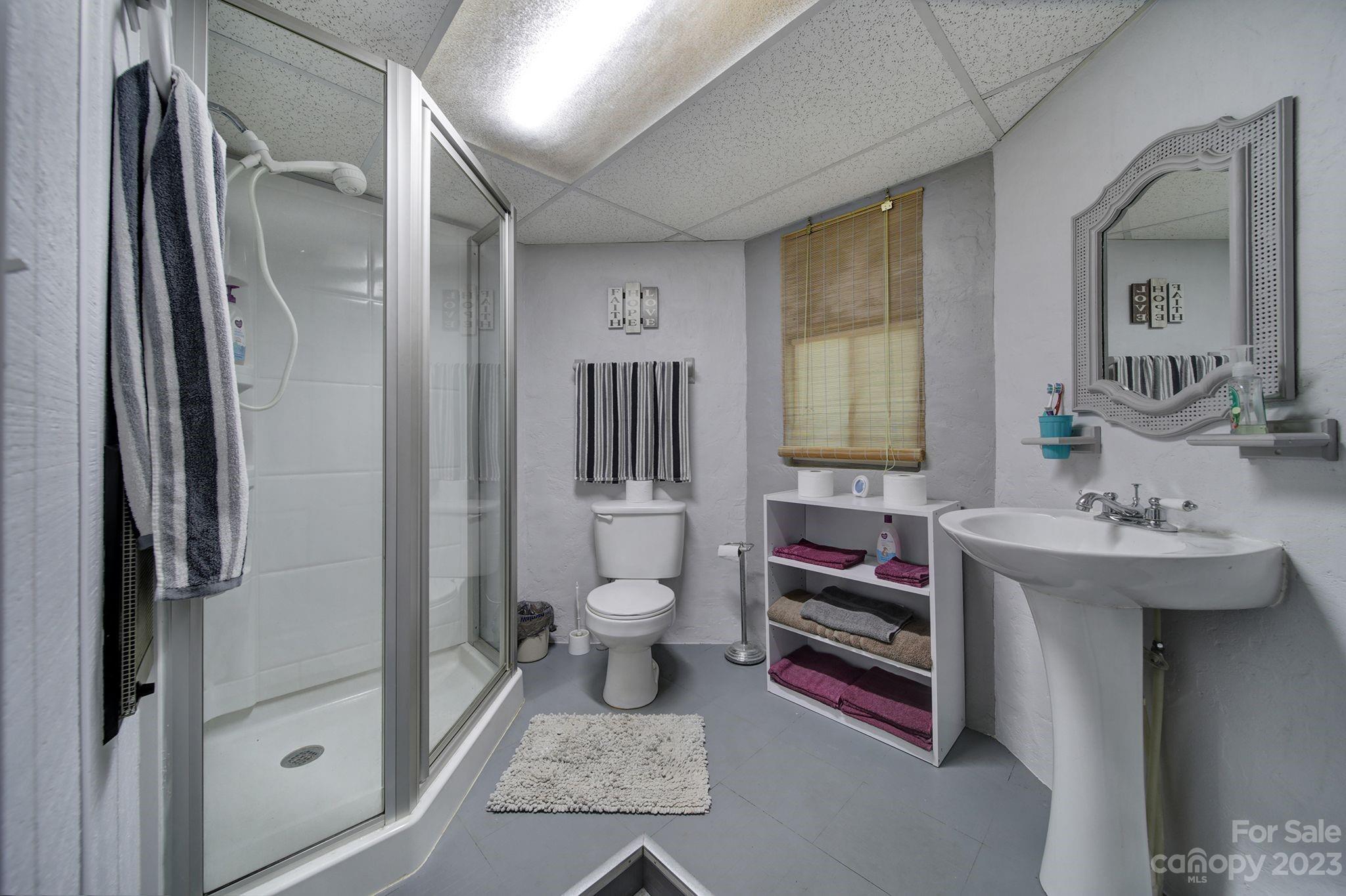 332 Boggs Road Thomasville, NC 27360 - Photo 32 of 41 a bathroom with a sink toilet and shower