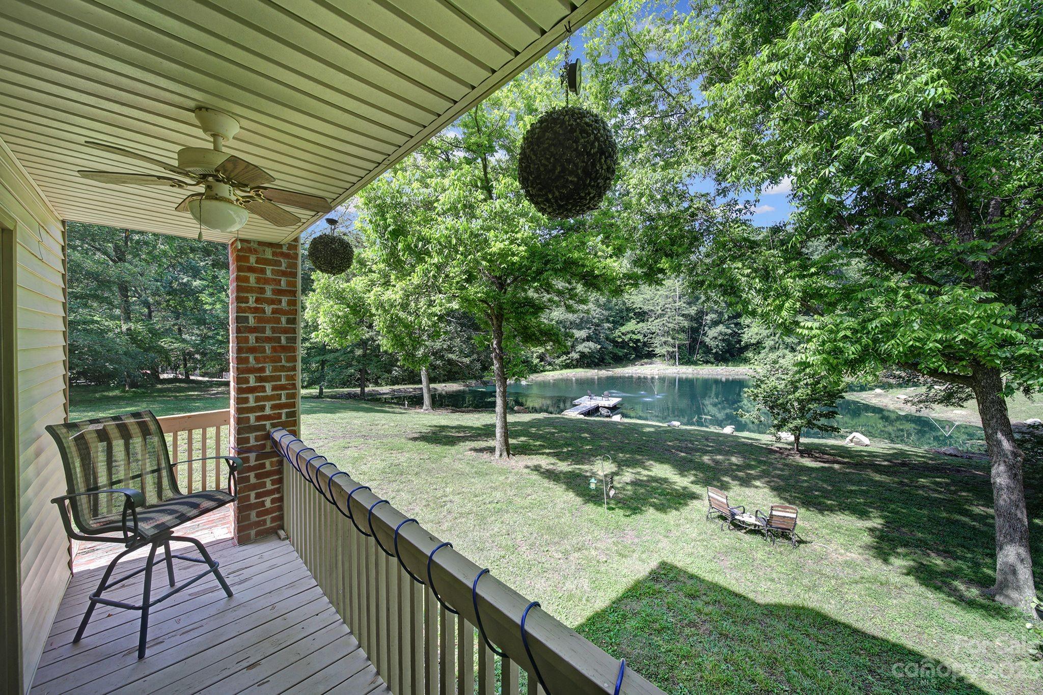 332 Boggs Road Thomasville, NC 27360 - Photo 35 of 41 a view of a backyard with sitting area and floor to ceiling window