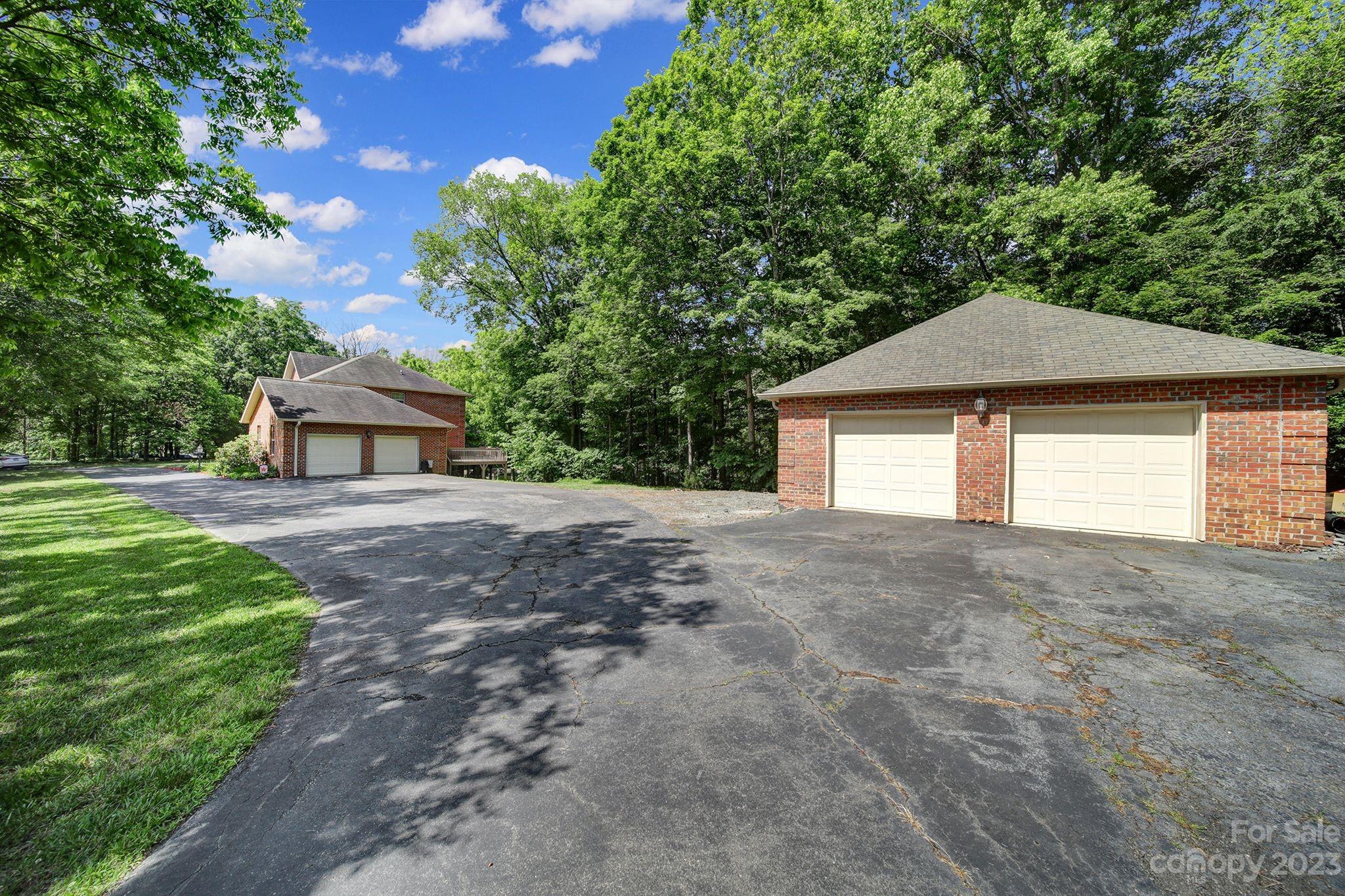 332 Boggs Road Thomasville, NC 27360 - Photo 38 of 41 a front view of a house with a yard and garage