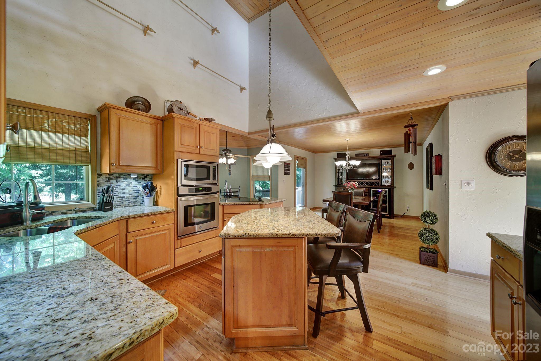 332 Boggs Road Thomasville, NC 27360 - Photo 6 of 41 a kitchen with stainless steel appliances granite countertop a stove and a wooden cabinets