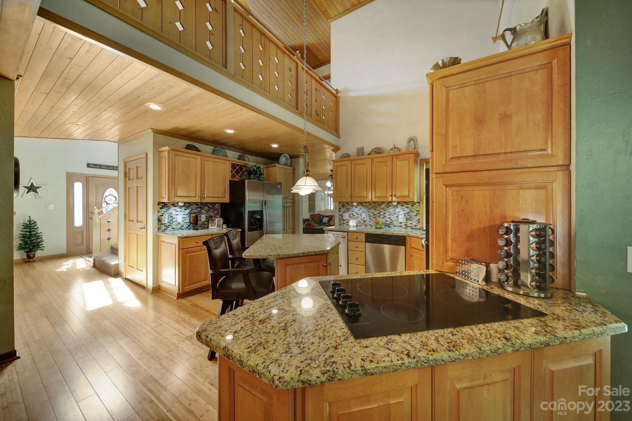 332 Boggs Road Thomasville, NC 27360 - Photo 7 of 41 a kitchen with stainless steel appliances granite countertop a sink refrigerator and cabinets