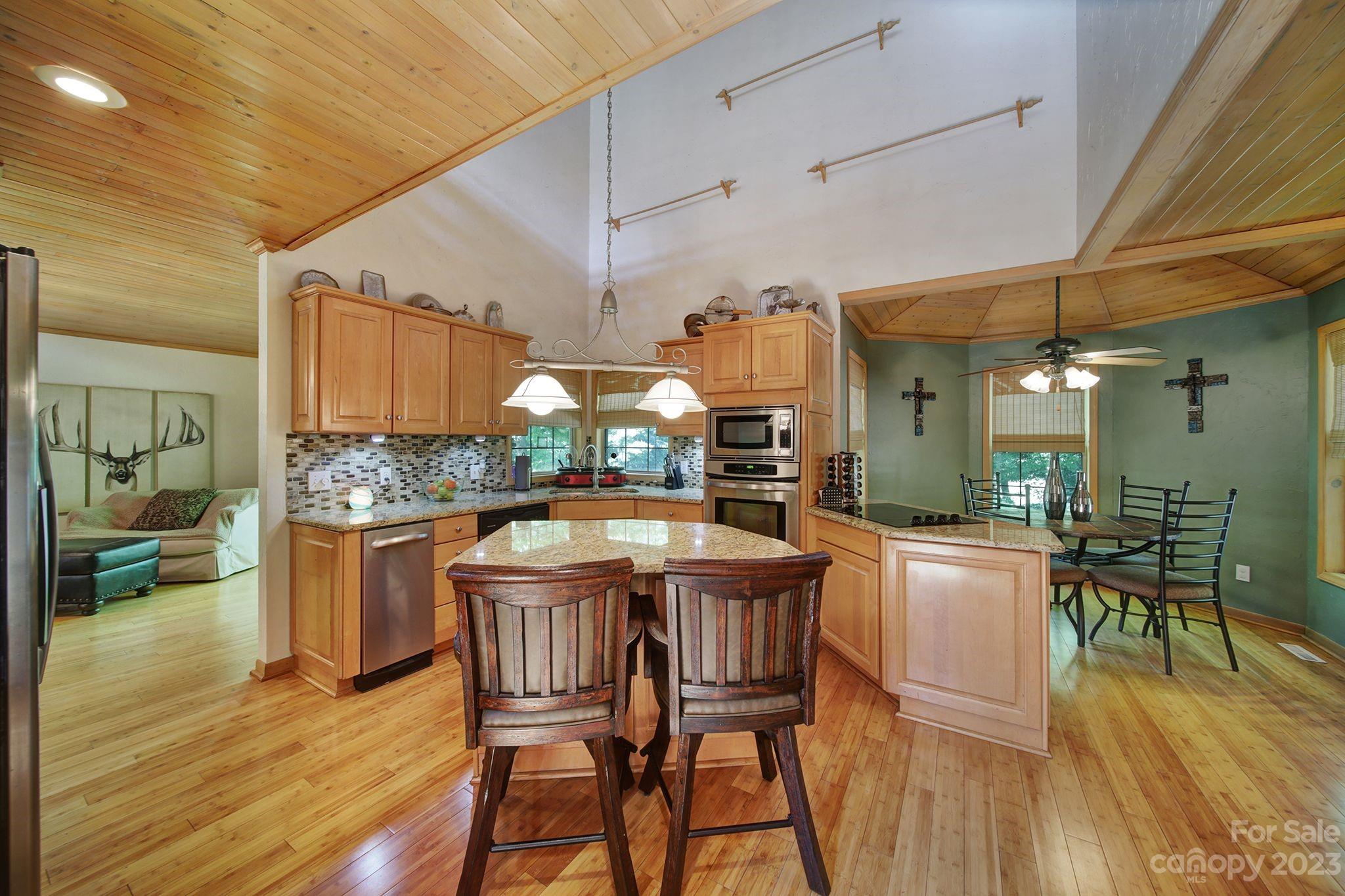 332 Boggs Road Thomasville, NC 27360 - Photo 8 of 41 a kitchen with a table and chairs in it