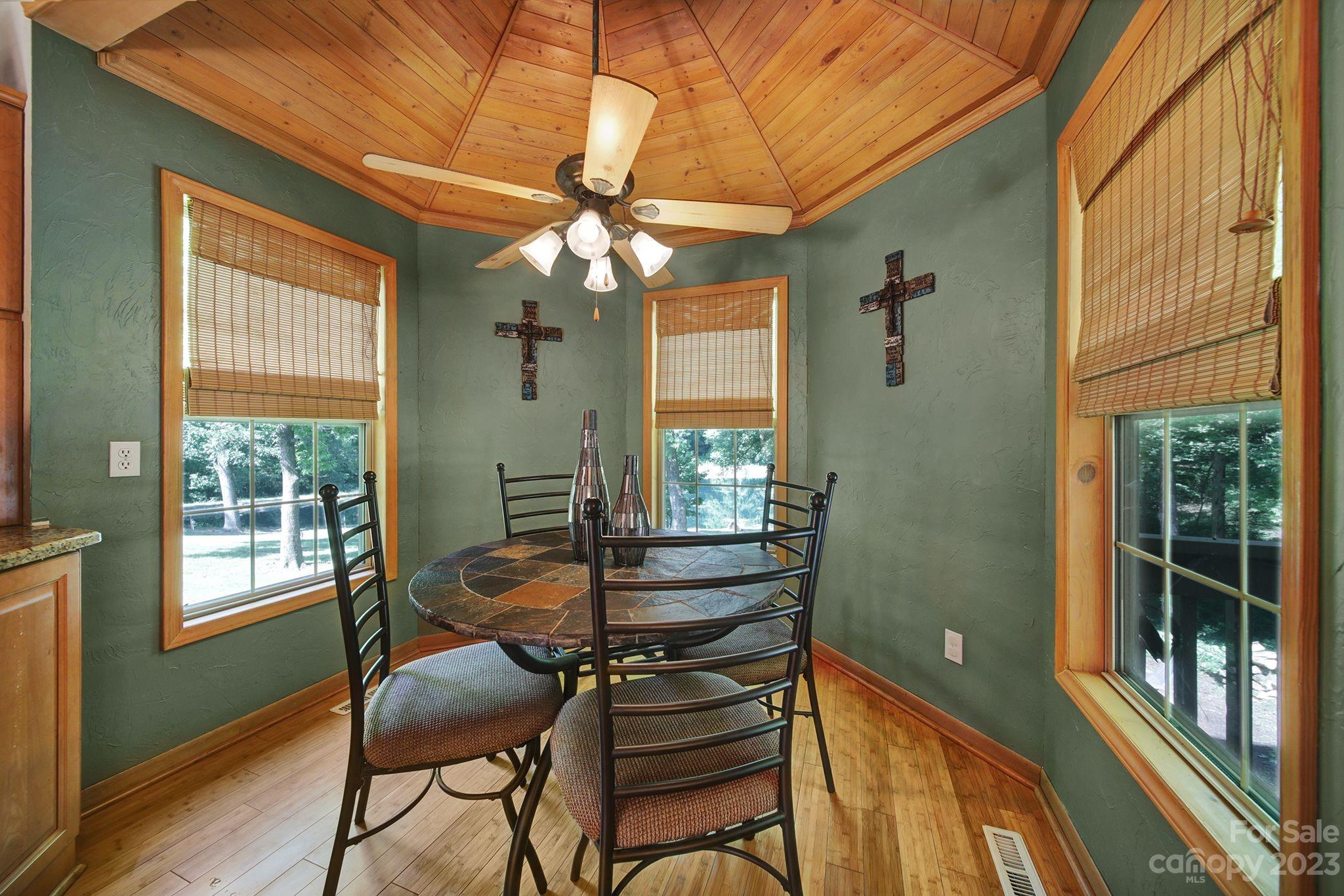 332 Boggs Road Thomasville, NC 27360 - Photo 9 of 41 a dining room with furniture a chandelier and wooden floor